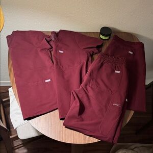 Figs Burgundy Scrub Set- from left to right, Small, medium, medium, medium.